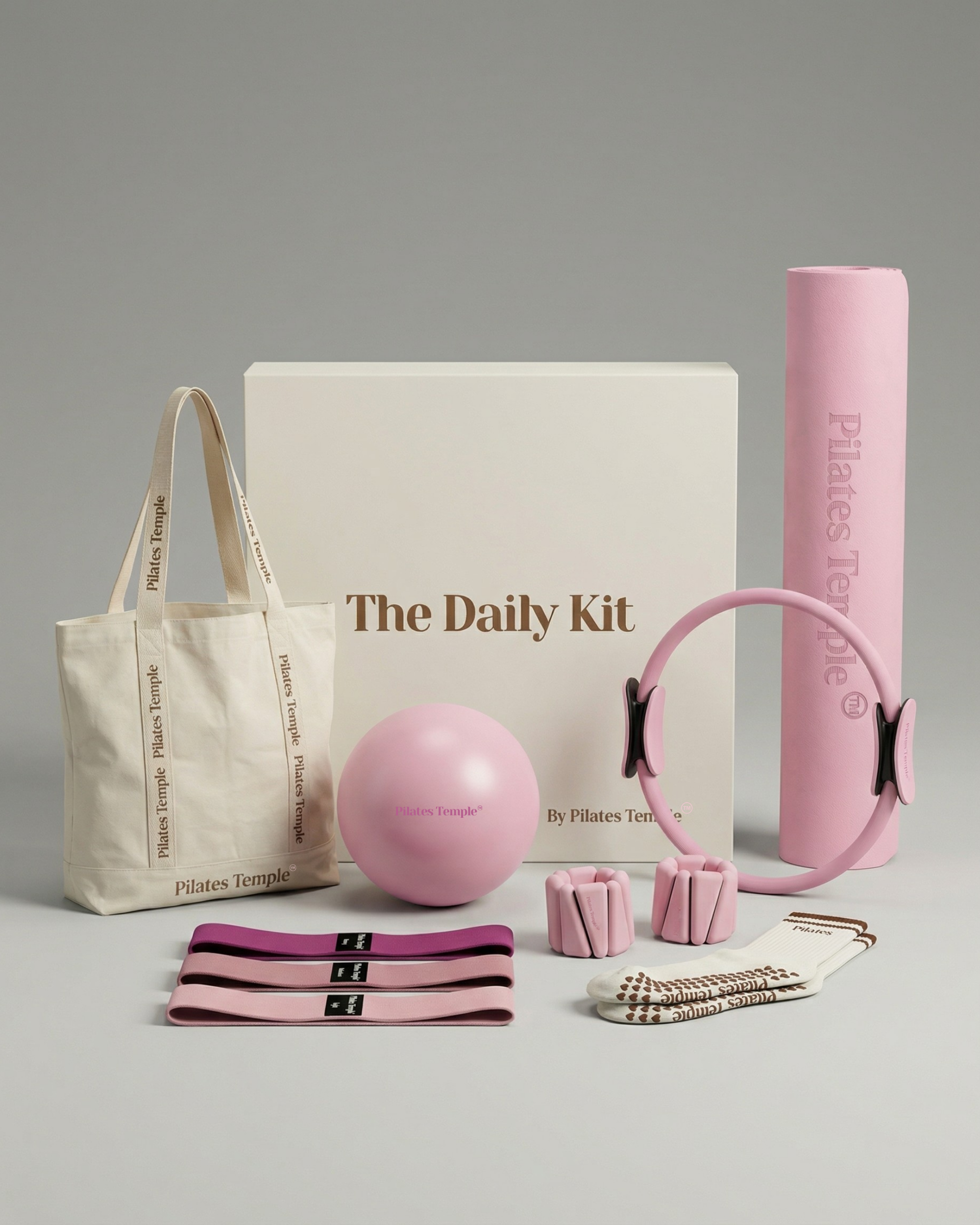 #color-Rose Coffret Pilates complet Daily Kit Rose : tapis, ring, ball, poids et autres accessoires.