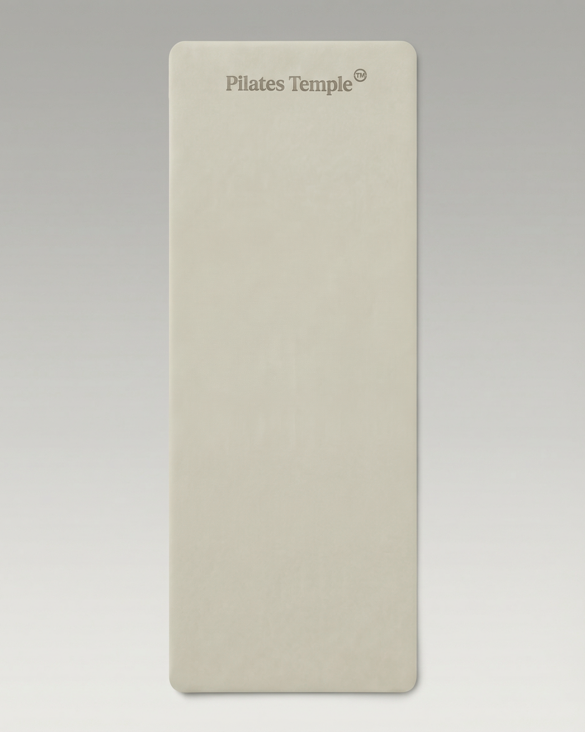 #color-Crème Tapis de Pilates antidérapant déroulé au sol.